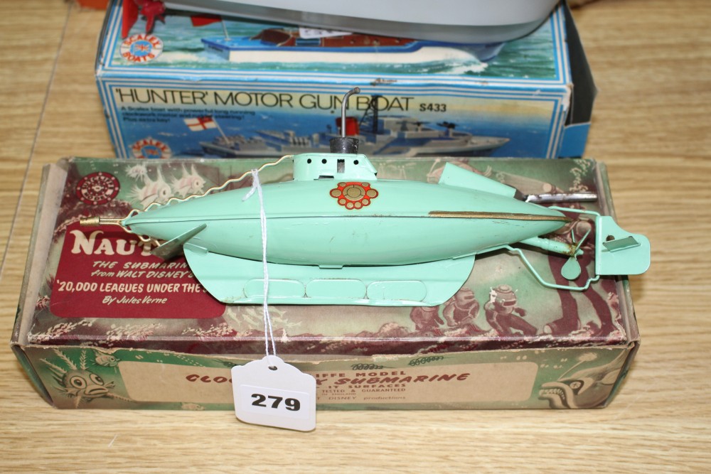 A boxed Sutcliffe model tinplate clockwork nautilus submarine, a boxed Scalex Hunter motor gun boat and two Hornby plastic bodied speed